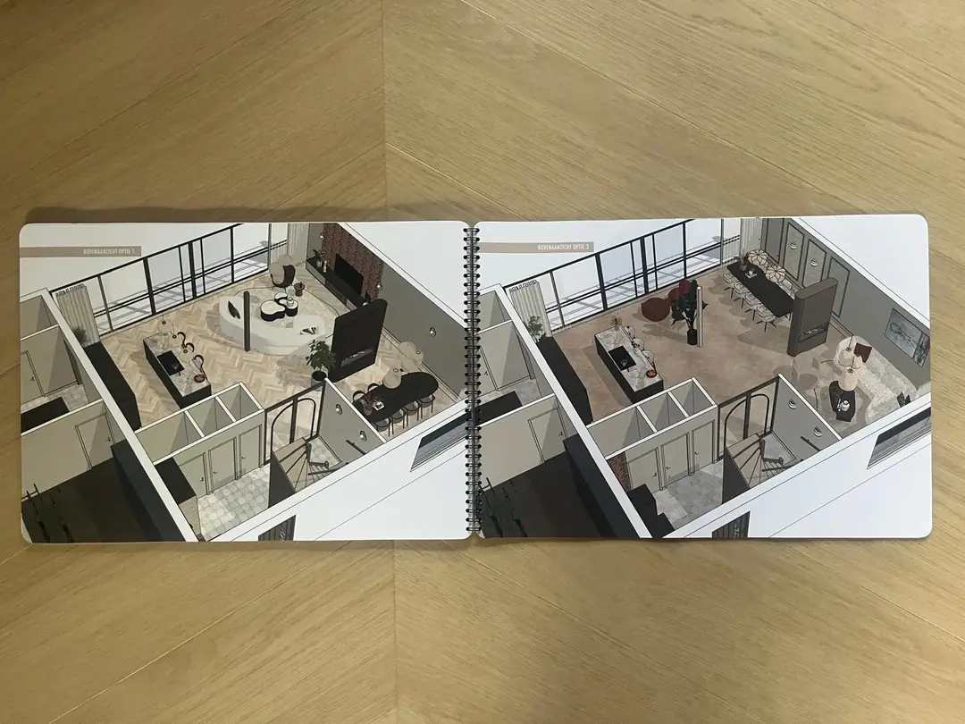 Ontwerpboek van Interieurstudio Laan opengeklapt op twee bovenaanzichten met indelingsvarianten van het woonhuis